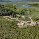 A 558-acre Wyoming ranch sat unsold for 14 months even after its price fell from nearly  million to  million; when owners scheduled a no-reserve auction, a buyer made an offer before bidding even began