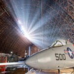 An 83-year-old Oregon blimp hangar was sold for  after a storm tore a 200-foot hole in its roof; after nearly 10 months shut, the air museum inside is now set to reopen on October 29