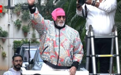 Amid bomb threat email and health concerns, Amitabh Bachchan greets fans outside Jalsa, protective son Abhishek Bachchan joins his father |