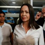 ‘I am here. With you’: Maria Corina Machado returns to Venezuela from exile