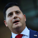 A federal judge ruled Trump-appointed prosecutor Bill Essayli is unlawfully serving as Los Angeles’s top U.S. attorney and disqualified him from two cases, but paused the disqualification while the Justice Department seeks a stay